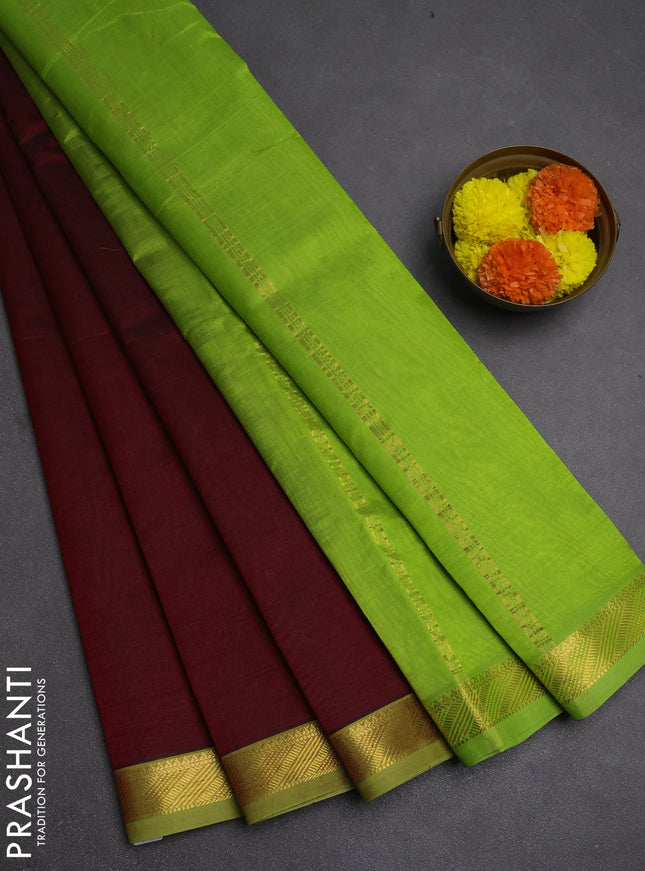 Silk cotton saree maroon and light green with plain body and zari woven border