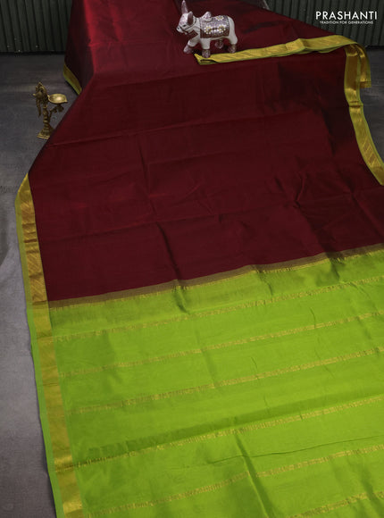 Silk cotton saree maroon and light green with plain body and zari woven border