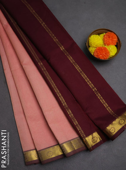 Silk cotton saree peach shade and deep maroon with plain body and zari woven border