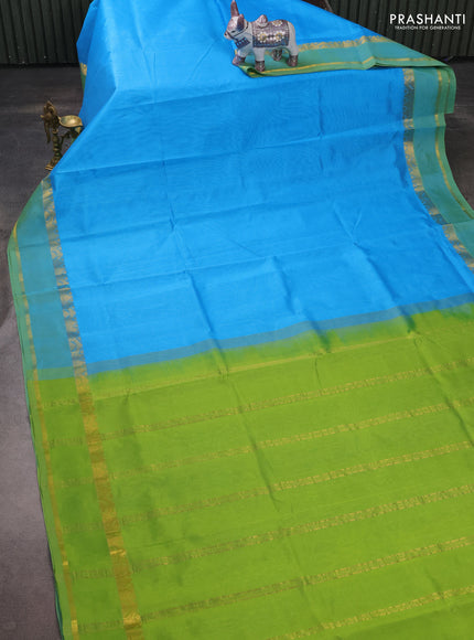 Silk cotton saree blue and light green with plain body and rettapet zari woven border