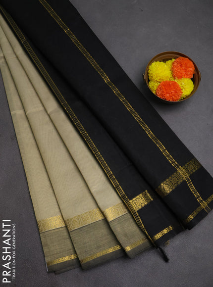 Silk cotton saree beige and black with plain body and rettapet zari woven border