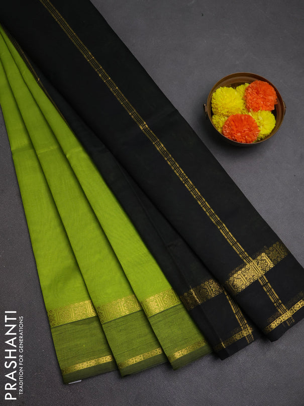 Silk cotton saree light green and black with plain body and rettapet zari woven border