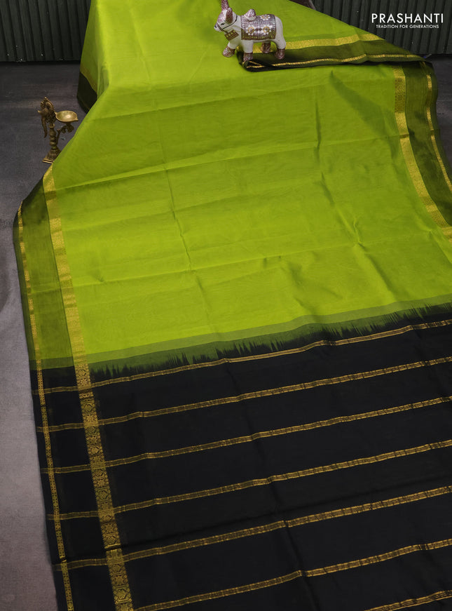 Silk cotton saree light green and black with plain body and rettapet zari woven border