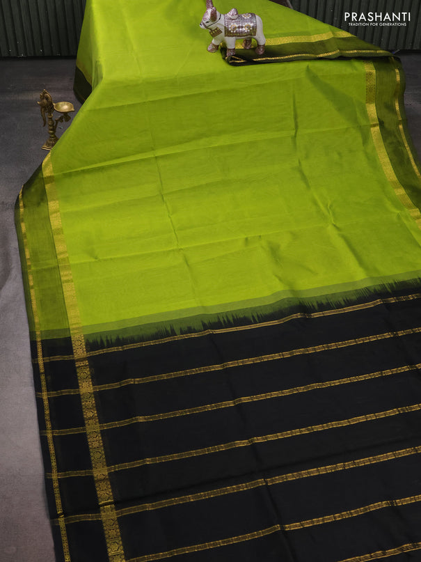 Silk cotton saree light green and black with plain body and rettapet zari woven border