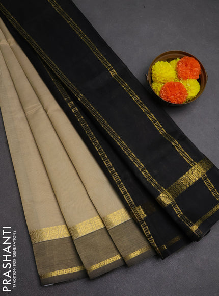 Silk cotton saree beige and black with plain body and rettapet zari woven border