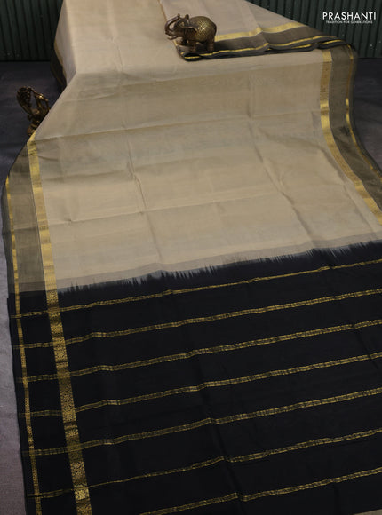Silk cotton saree beige and black with plain body and rettapet zari woven border