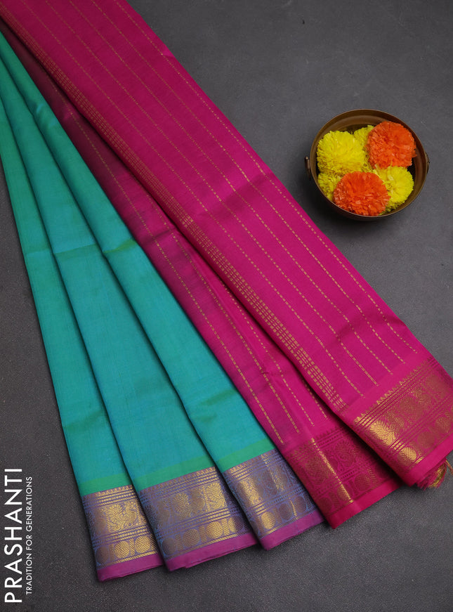 Silk cotton saree dual shade of teal bluish green and magenta pink with plain body and zari woven border