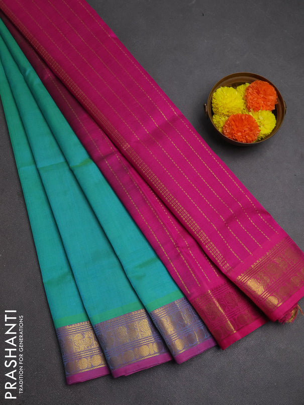 Silk cotton saree dual shade of teal bluish green and magenta pink with plain body and zari woven border
