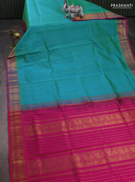 Silk cotton saree dual shade of teal bluish green and magenta pink with plain body and zari woven border