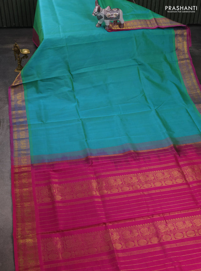 Silk cotton saree dual shade of teal bluish green and magenta pink with plain body and zari woven border