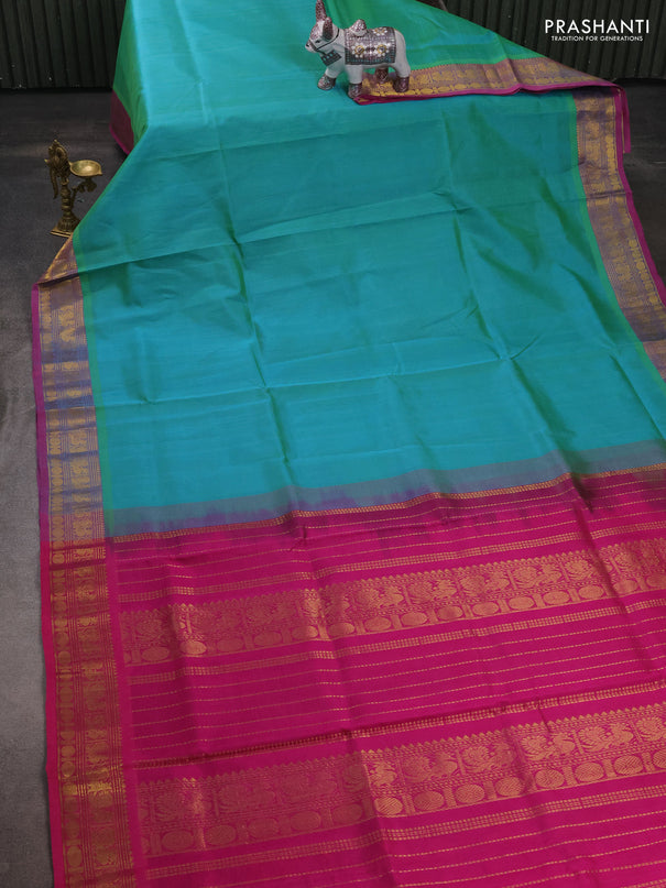 Silk cotton saree dual shade of teal bluish green and magenta pink with plain body and zari woven border