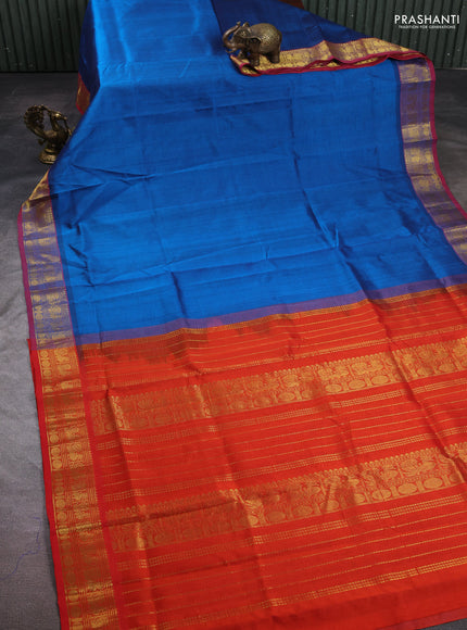 Silk cotton saree cs blue and rustic orange with plain body and zari woven border
