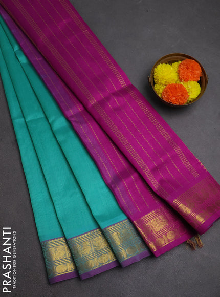 Silk cotton saree teal blue and purple with plain body and zari woven border