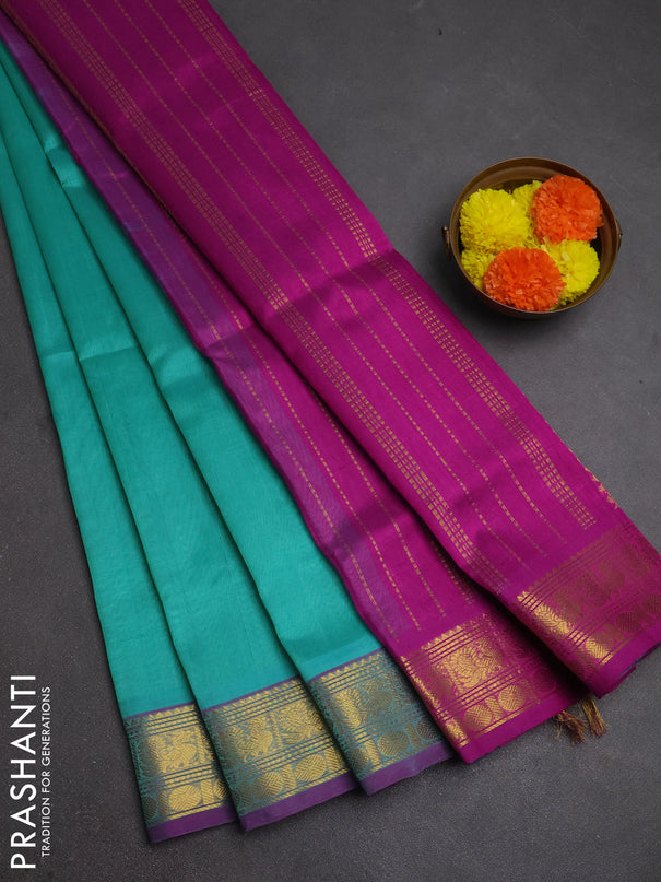 Silk cotton saree teal blue and purple with plain body and zari woven border