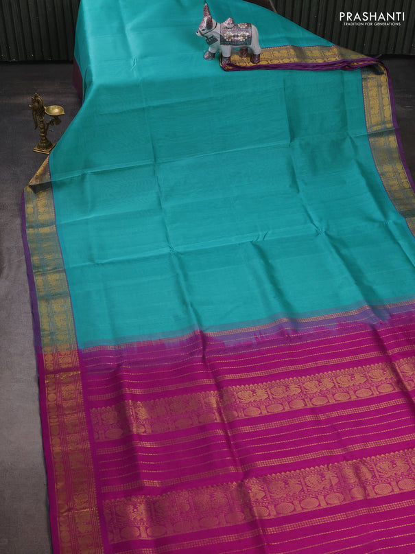 Silk cotton saree teal blue and purple with plain body and zari woven border