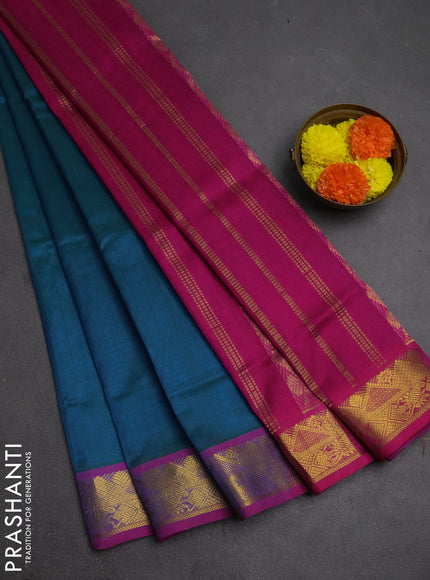 Silk cotton saree dual shade of bluish green and magenta pink with plain body and zari woven border