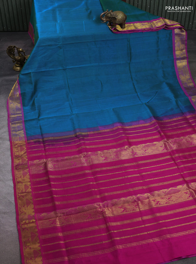 Silk cotton saree dual shade of bluish green and magenta pink with plain body and zari woven border