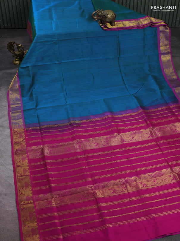 Silk cotton saree dual shade of bluish green and magenta pink with plain body and zari woven border