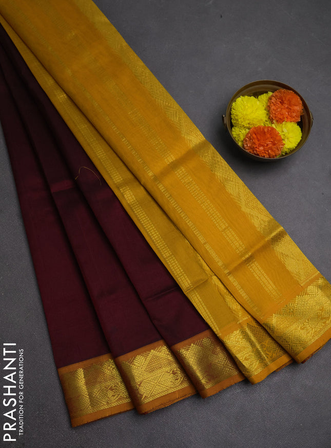 Silk cotton saree deep maroon and mustard yellow with plain body and zari woven border