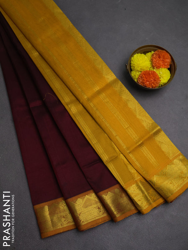 Silk cotton saree deep maroon and mustard yellow with plain body and zari woven border