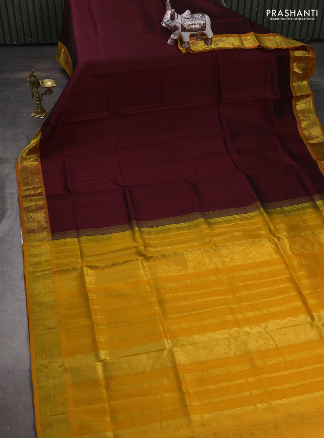 Silk cotton saree deep maroon and mustard yellow with plain body and zari woven border