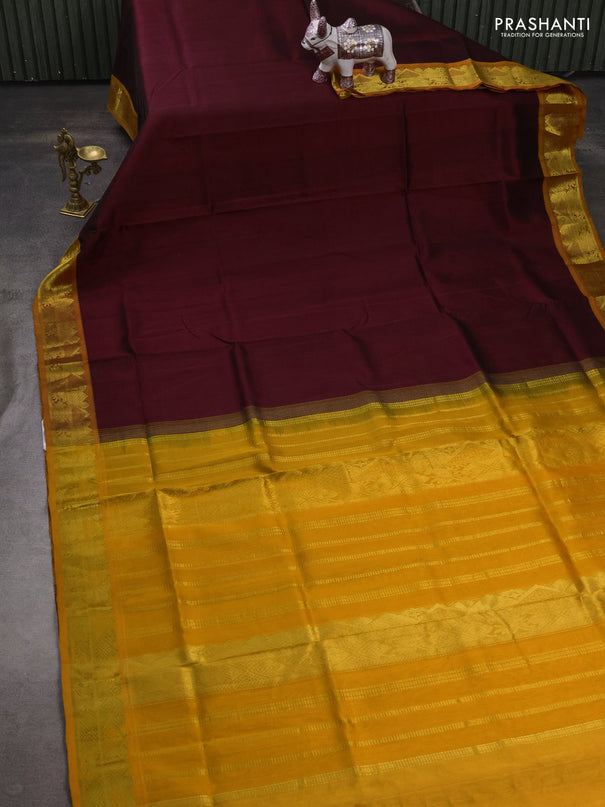 Silk cotton saree deep maroon and mustard yellow with plain body and zari woven border