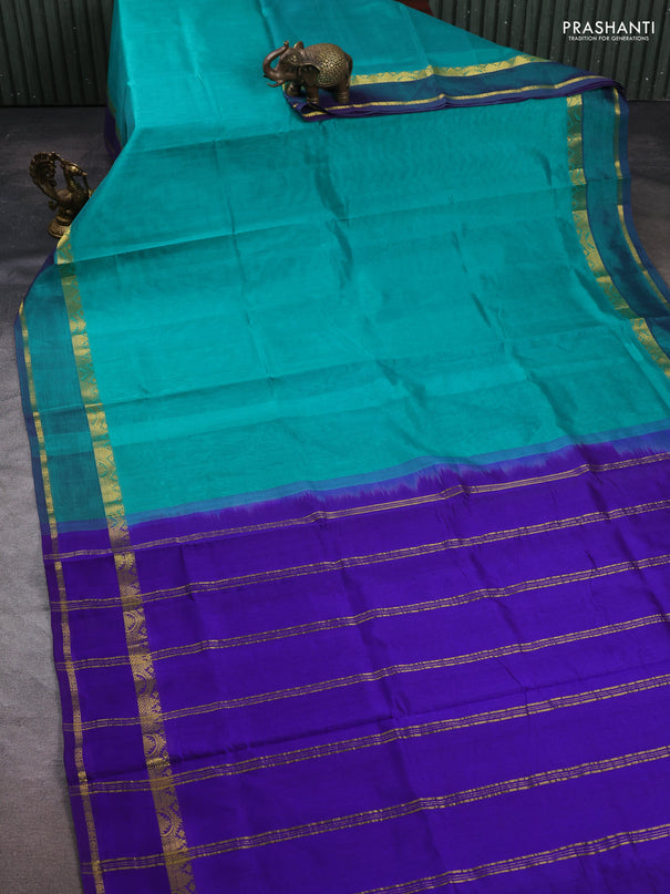 Silk cotton saree teal green and violet with plain body and rettapet zari woven border