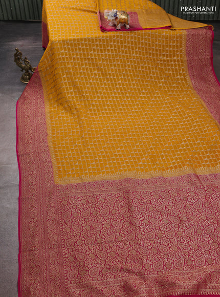 Banarasi georgette saree mustard yellow and pink with allover thread & zari checks buttas and woven border