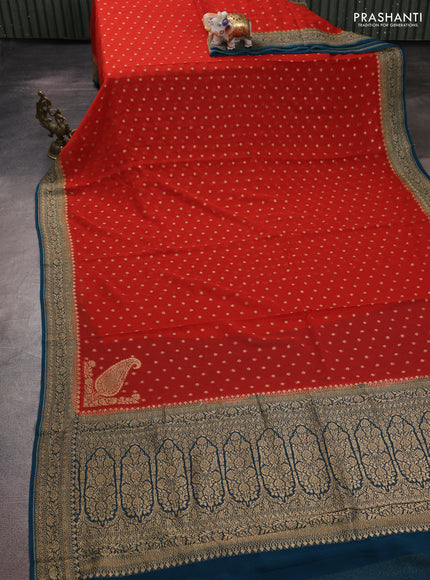 Banarasi georgette saree rust shade and peacock green with allover thread & zari woven buttas and woven border