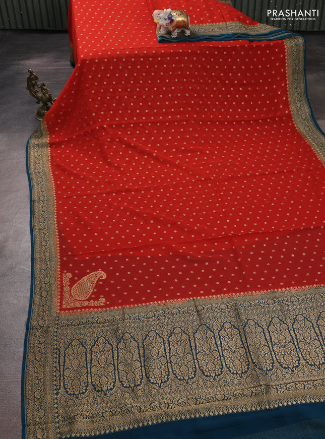 Banarasi georgette saree rust shade and peacock green with allover thread & zari woven buttas and woven border