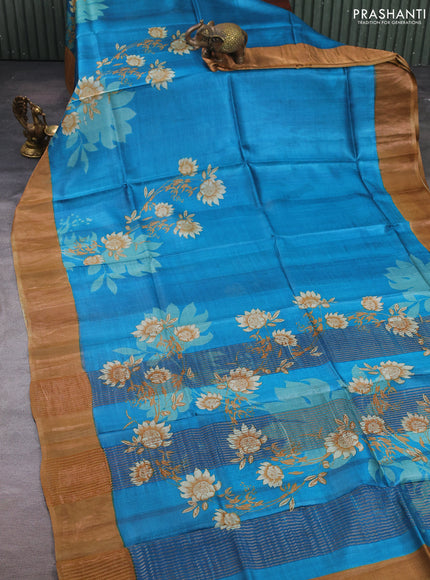 Pure tussar silk saree cs blue and sandal with floral prints and zari woven border