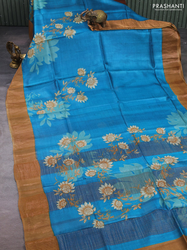 Pure tussar silk saree cs blue and sandal with floral prints and zari woven border