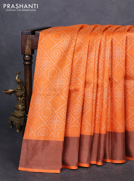 Pure tussar silk saree orange with allover bandhani prints and zari woven border