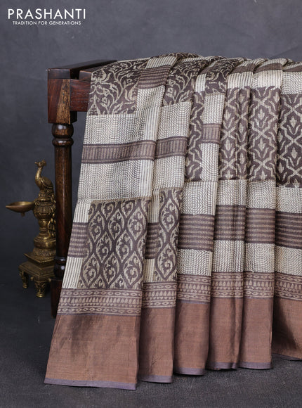 Pure tussar silk saree cream and brown shade with allover prints and zari woven border