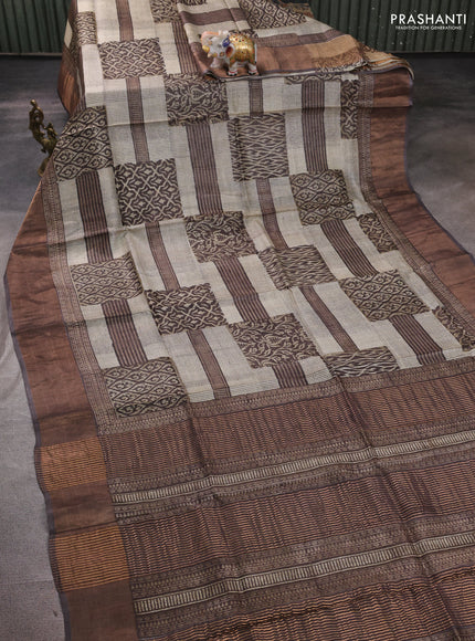 Pure tussar silk saree cream and brown shade with allover prints and zari woven border