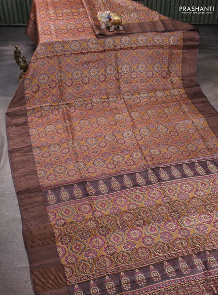 Pure tussar silk saree dark mustard and brown with allover ajrakh prints and zari woven border