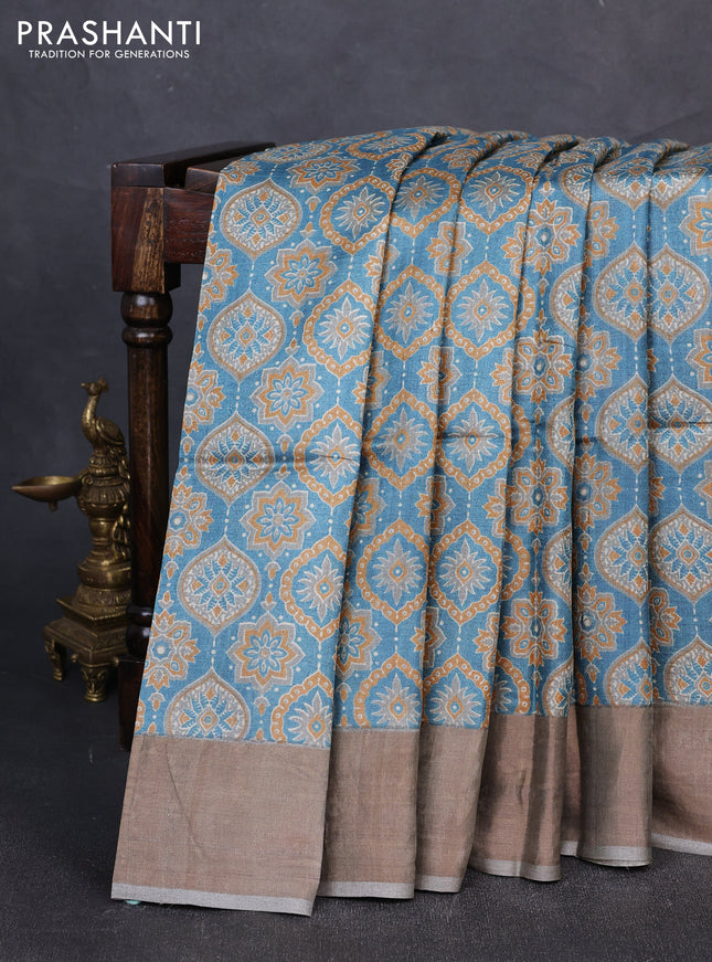 Pure tussar silk saree pastel blue and grey with allover ajrakh prints and zari woven border
