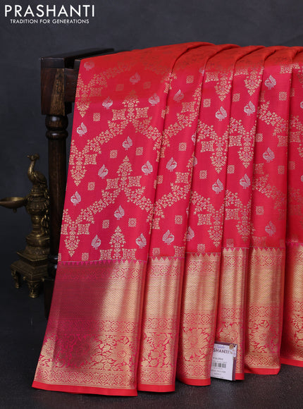 Pure kanchipuram silk saree dual shade of pinkish orange with allover zari woven brocade weaves and rich zari woven border