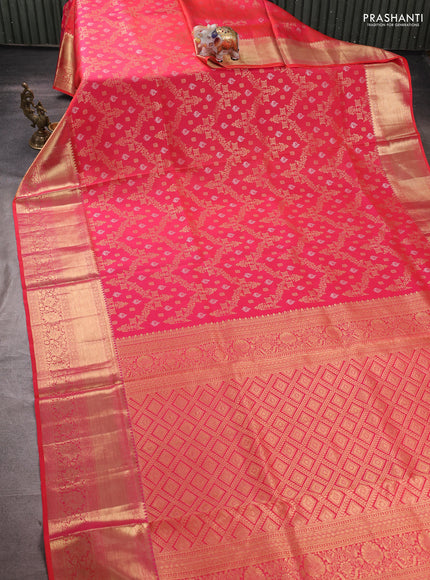 Pure kanchipuram silk saree dual shade of pinkish orange with allover zari woven brocade weaves and rich zari woven border