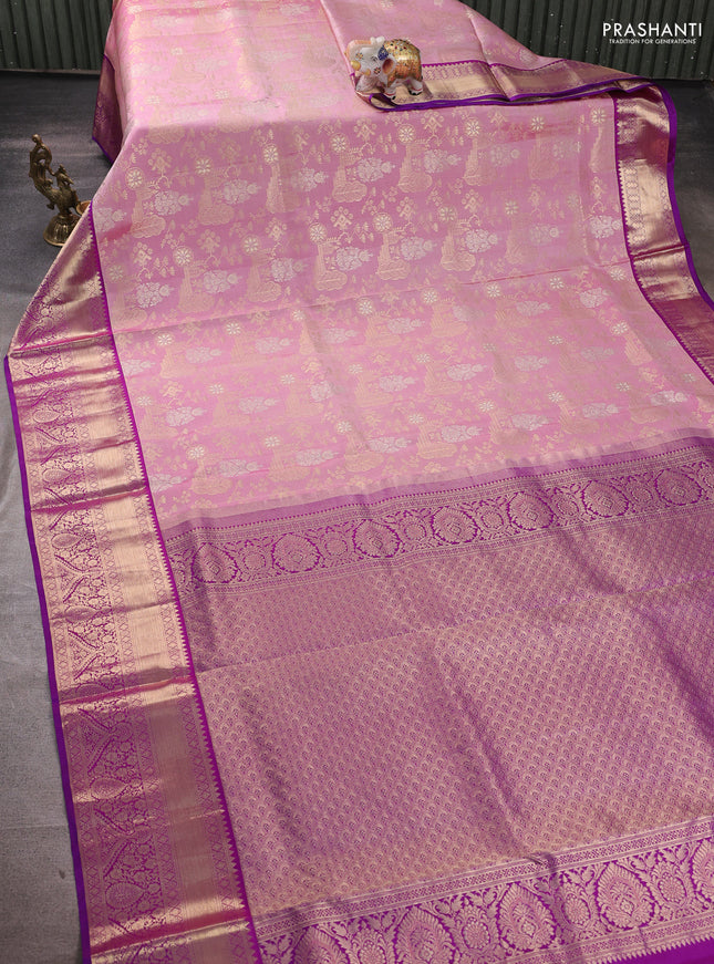 Pure kanchipuram silk saree pastel pink and purple with allover zari woven brocade weaves and rich zari woven border