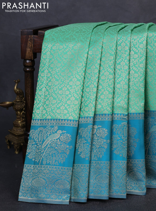 Pure kanchipuram silk saree teal green and cs blue with allover zari woven brocade weaves and long rich zari woven border