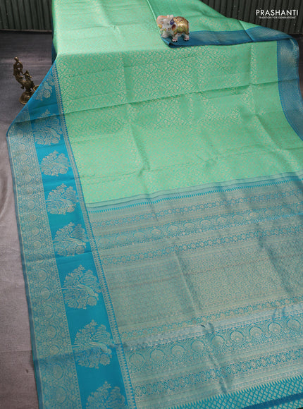 Pure kanchipuram silk saree teal green and cs blue with allover zari woven brocade weaves and long rich zari woven border