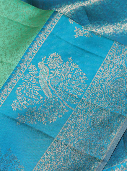 Pure kanchipuram silk saree teal green and cs blue with allover zari woven brocade weaves and long rich zari woven border