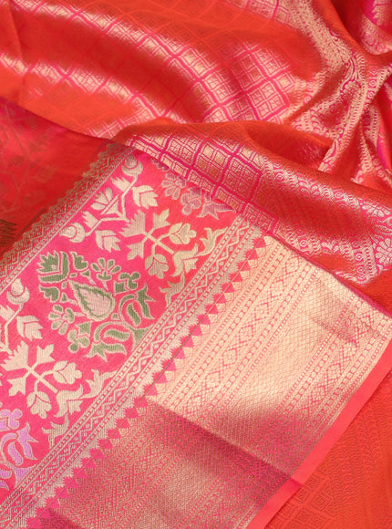 Pure kanchipuram silk saree dual shade of pinkish orange with allover zari woven brocade weaves and rich zari woven border