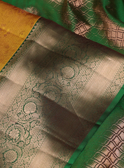 Pure kanchipuram silk saree dark mustard and green with allover zari woven brocade weaves and long rich zari woven border