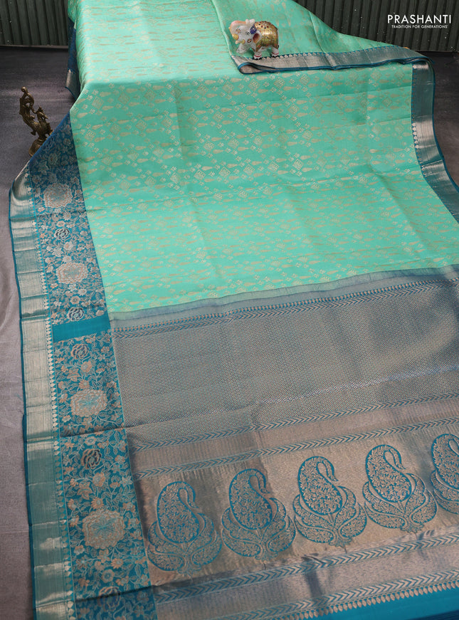 Pure kanchipuram silk saree teal green shade and peacock green with allover zari woven brocade weaves and rich floral zari woven border