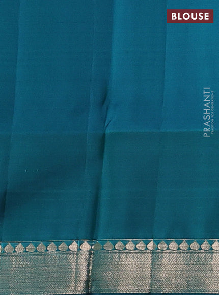 Pure kanchipuram silk saree teal green shade and peacock green with allover zari woven brocade weaves and rich floral zari woven border