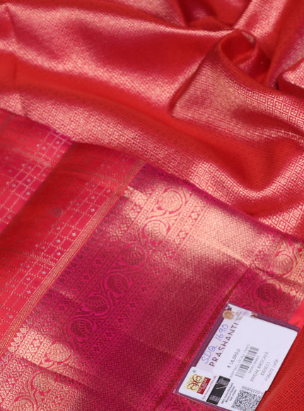 Pure kanchipuram silk saree dual shade of pinkish orange with allover zari woven brocade weaves and rich zari woven border