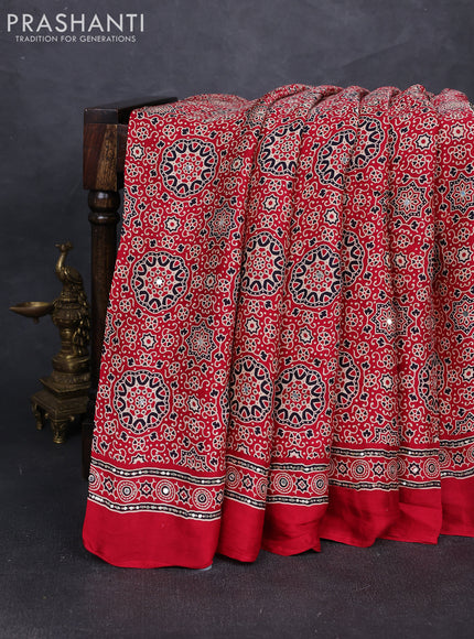 Modal silk saree tomato red with allover ajrakh prints and mirror & sequin embroidery pallu