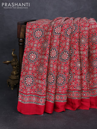 Modal silk saree tomato red with allover ajrakh prints and mirror & sequin embroidery pallu